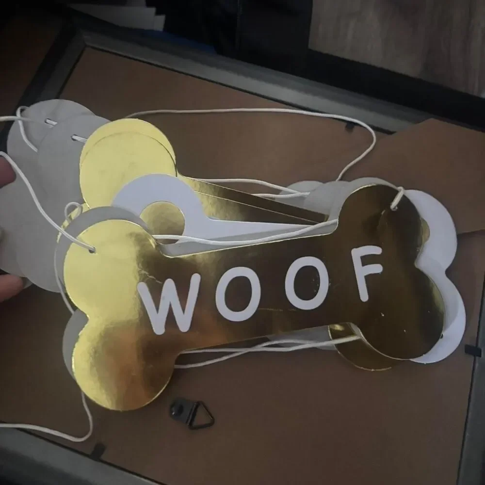 2 gold & white dog bone garlands (they say woof & have gold & white polka dots)